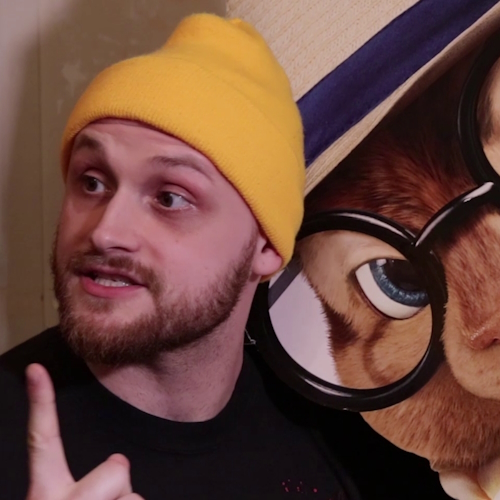 Photo of Chris with holding up his finger.